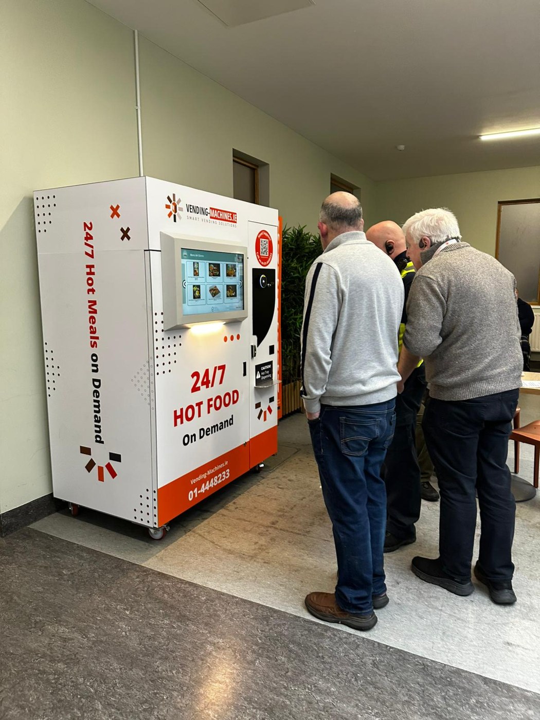 People beside the white and orange MIDA in a Dublin hospital